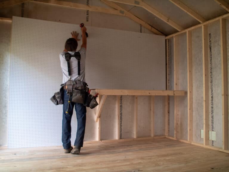 Worker setting up interior of building
